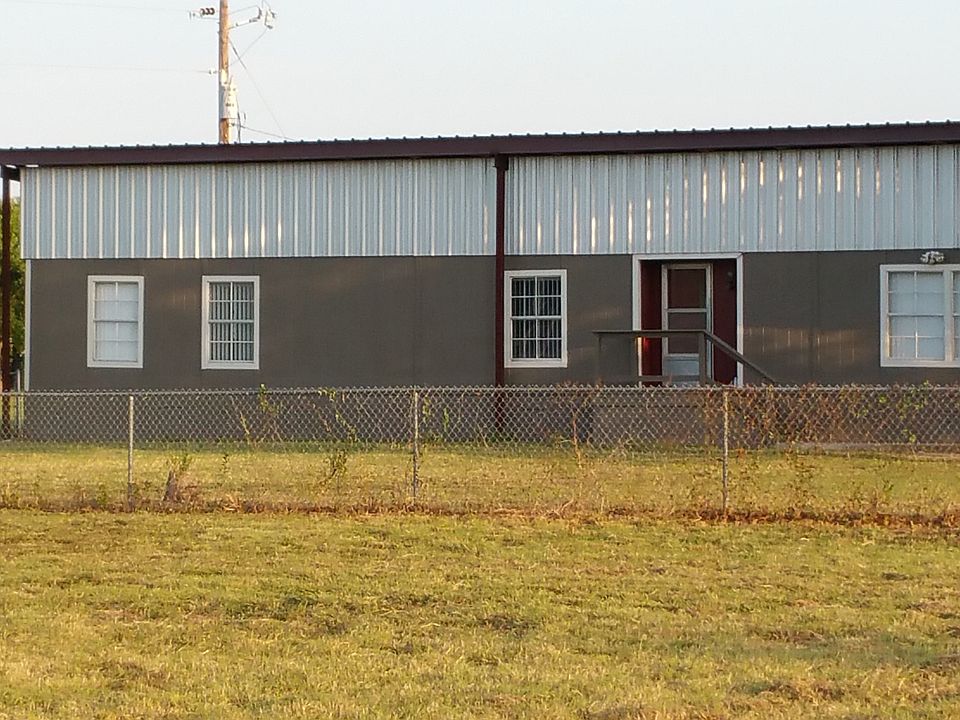 Metal roof over house and additional carport.