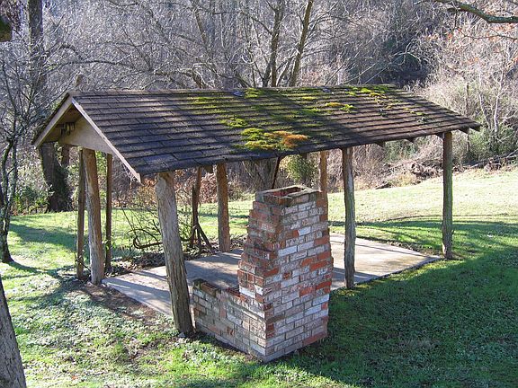 Covered picnic area with brick barbecue