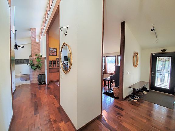 The entryway to the right, a look down to the living room.