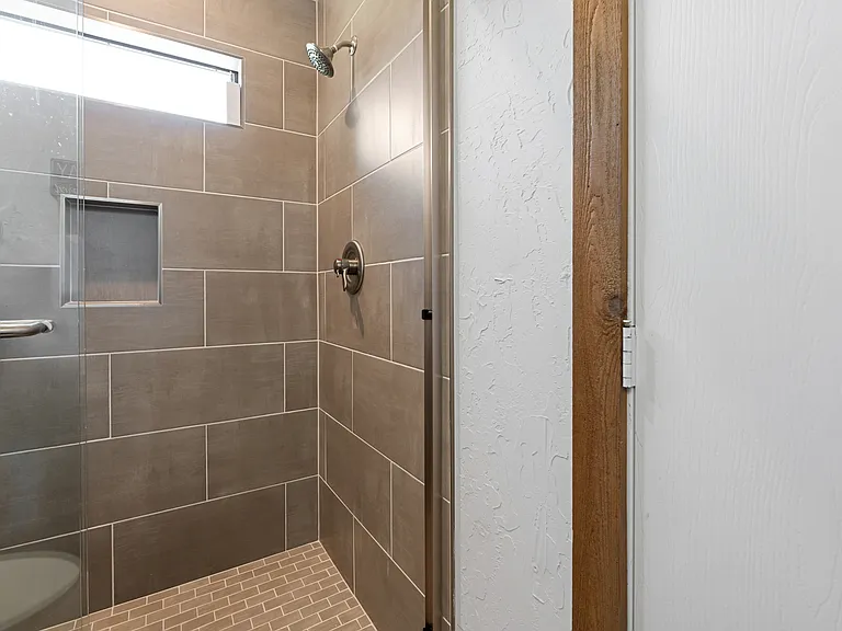 Bathroom #2 - walk-in shower, toilet and pedestal sink.