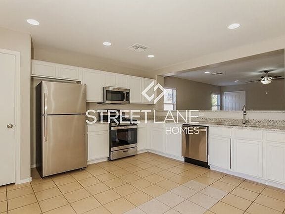 4th image of 12409 W Surrey Ave