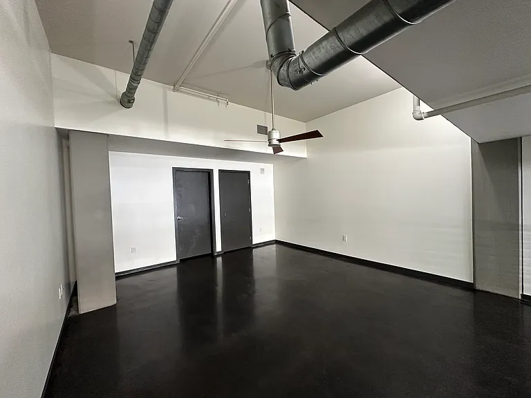 Loft level bedroom space. View from top of stairs.