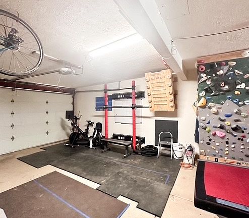 Climbing wall, pool table, storage, gym equipment