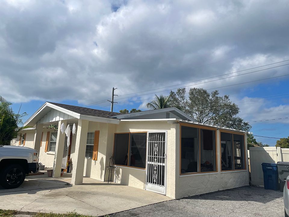 This is the front of the home, with a screened-in lanai/front porch.