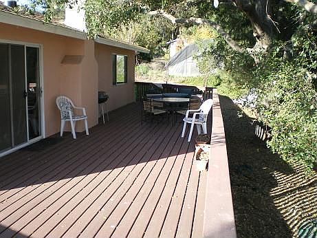 600 sq. ft. Trex deck, and mature oak tree.