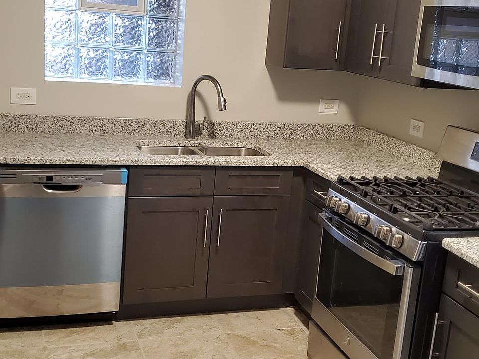 Kitchen, with granite counter tops, dishwasher, microwave and cooking gas oven
