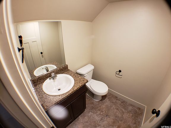 Downstairs half bath just off the garage and mudroom.