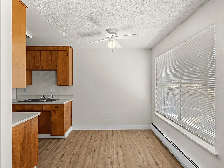 Bright dining space adjacent to the kitchen in a one-bedroom deluxe apartment at Palisades Apartments in Tacoma. Bright dining space adjacent to the kitchen in a one-bedroom deluxe apartment at Palisades Apartments in Tacoma.