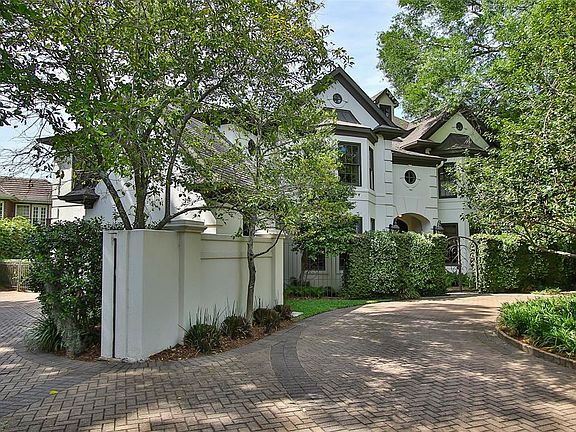 Welcome to 4 Saddle Creek in the heart of Memorial Villages, tucked between towering pines and evergreen holly bushes.