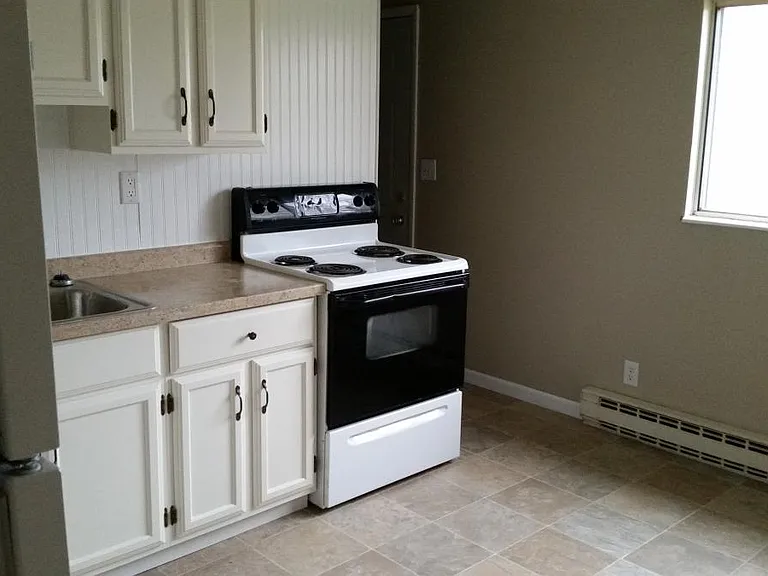 Eat in kitchen opens to back yard.