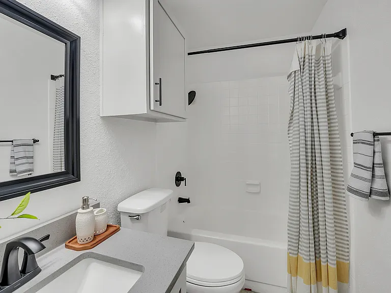 Experience the elegance of this bathroom's sleek and modern design.