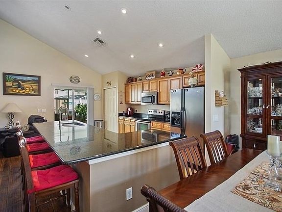 Granite counters and updated cabinets in kitchen.