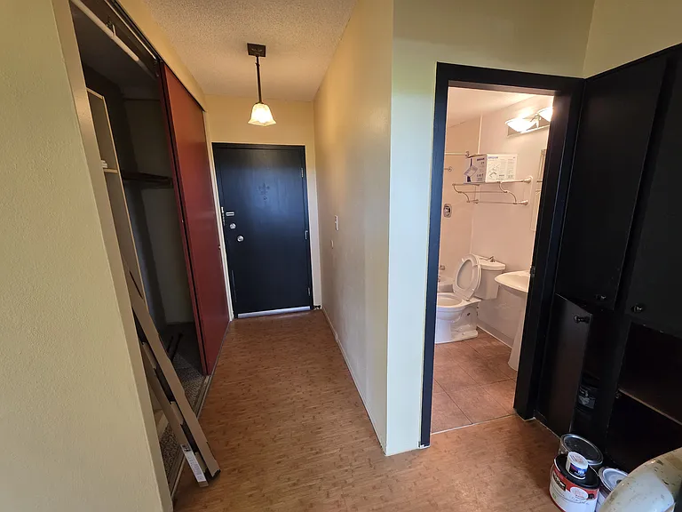 Closet, front door, and bathroom