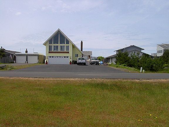 STREET SIDE OF HOUSE FROM ACROSS THE STREET