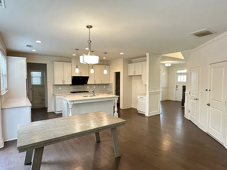 Open concept kitchen with upgraded and spacious cabinets and luxurious quartz countertop