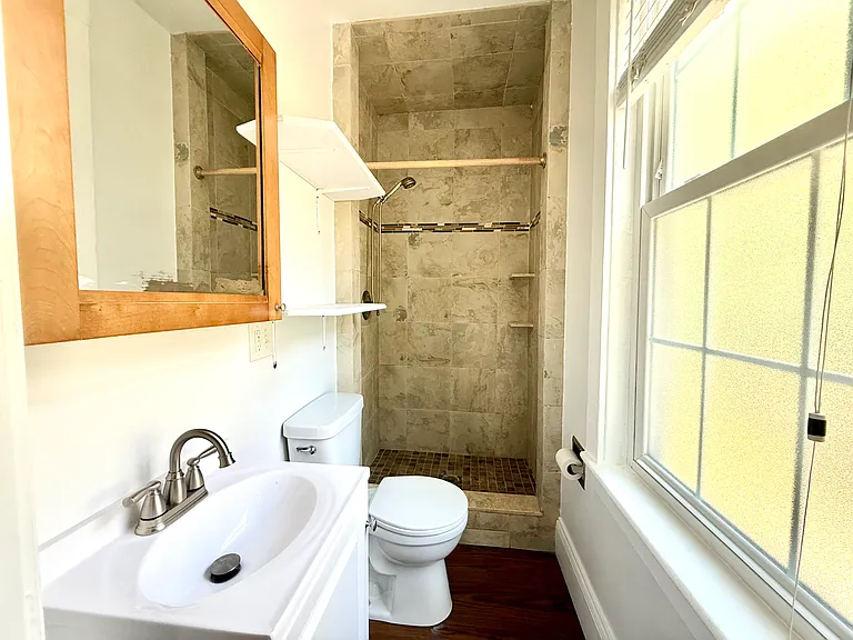 Full bath - located on 1 st level. Nice tiled shower.