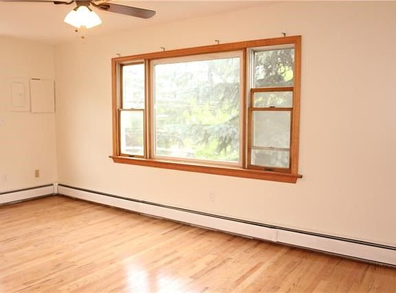 Spacious sun filled living room. All hardwood flooring in a