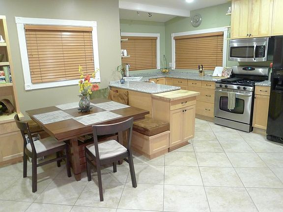 New kitchen with granite counters, custom built-in dinette w