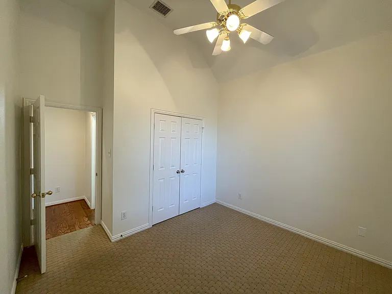 carpeted back bedroom