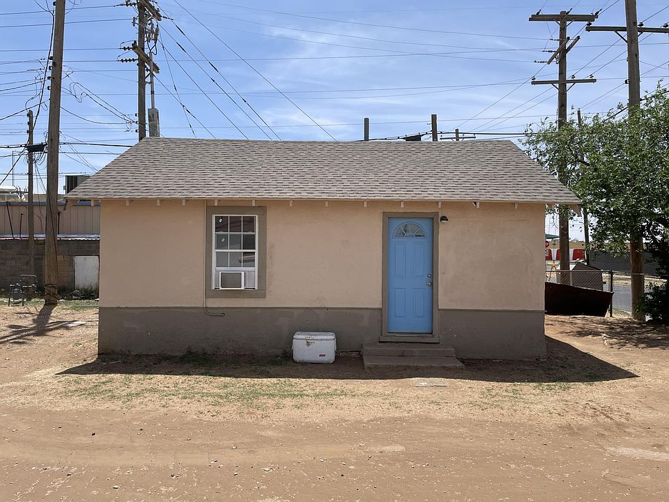 North side of house with yard & parking