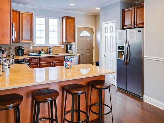 Granite counter tops, stainless steel appliances and counter seating for 4.
