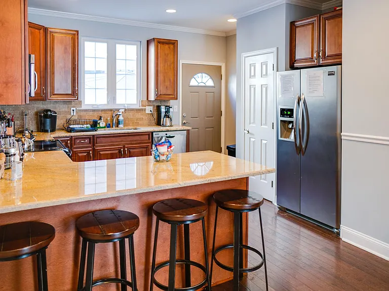 Granite counter tops, stainless steel appliances and counter seating for 4.