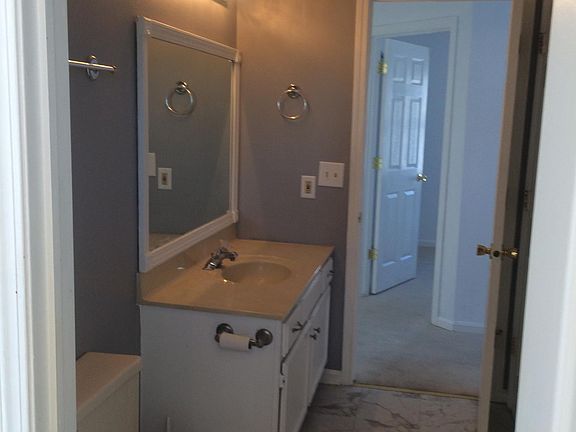 Upstairs main bathroom with bath tub and shower.