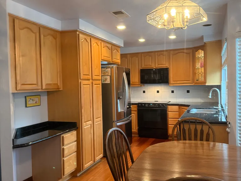 Hard wood cherry wood floors add beauty. Note additional lighting