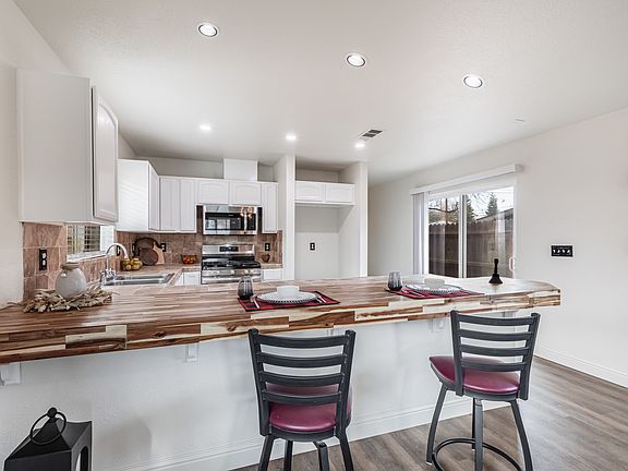 A new butcher block counter can accommodate up to four bar stools.