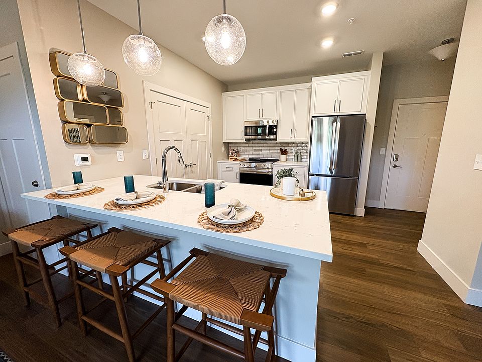 Modern White Kitchen with Stainless Steel Appliances