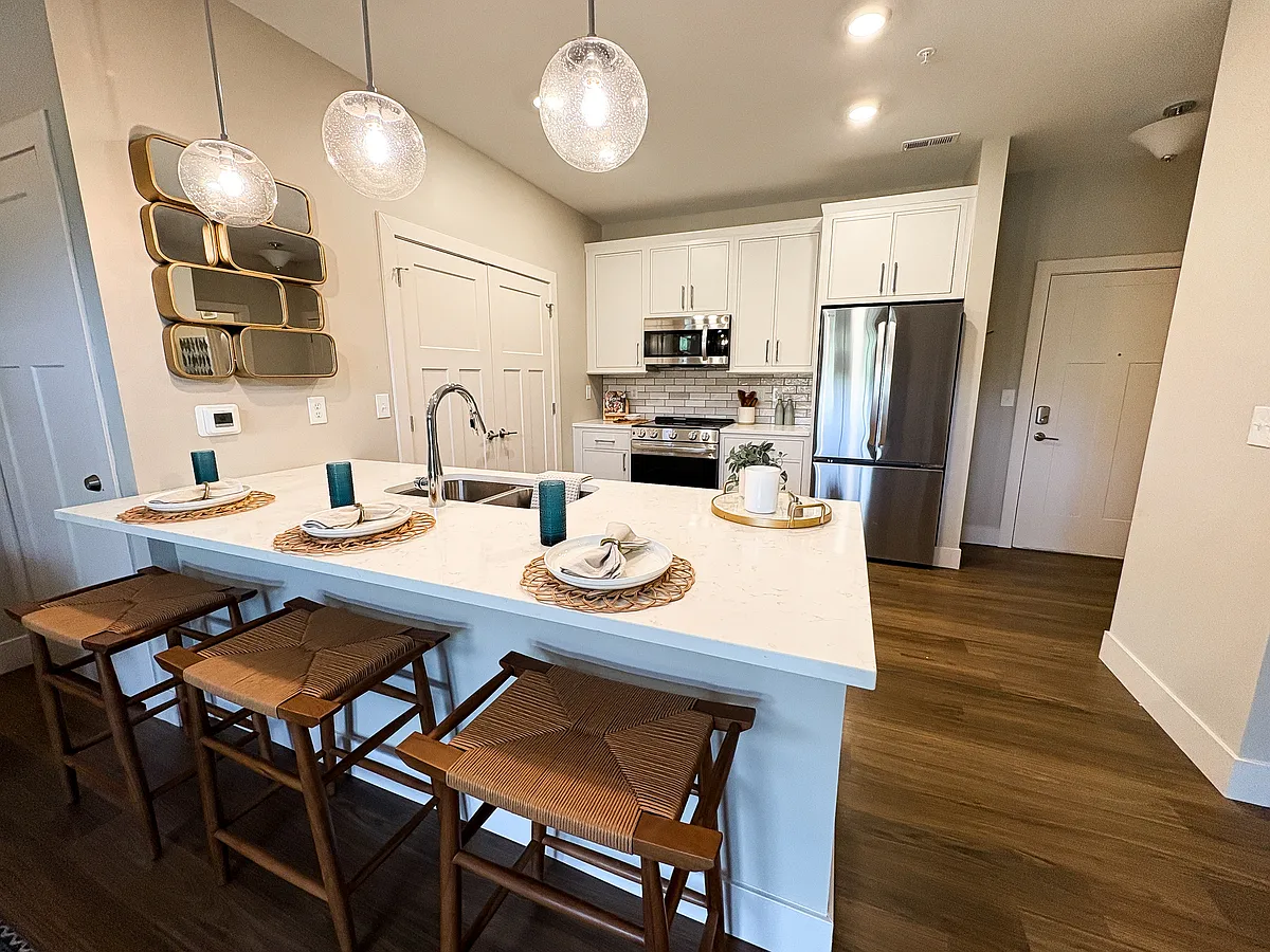 Modern White Kitchen with Stainless Steel Appliances - Woods of West Carmel
