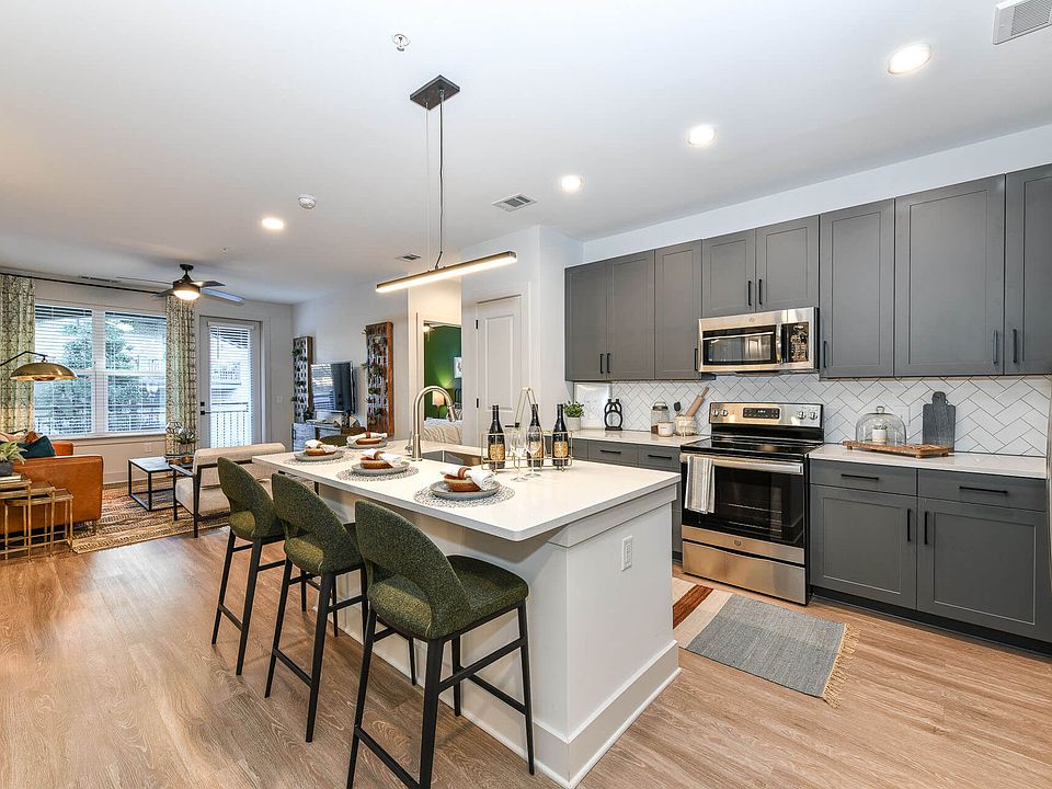 Kitchens are complete with an entertaining island and quartz countertops.