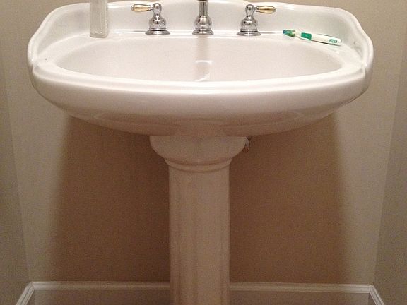 pedestal sink in half bath