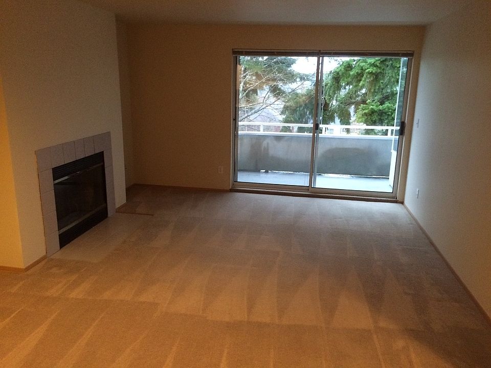 Living Room w/ Fireplace and Deck