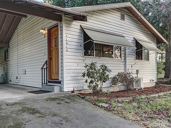 The front entrance is situated nicely under the covered carport. 