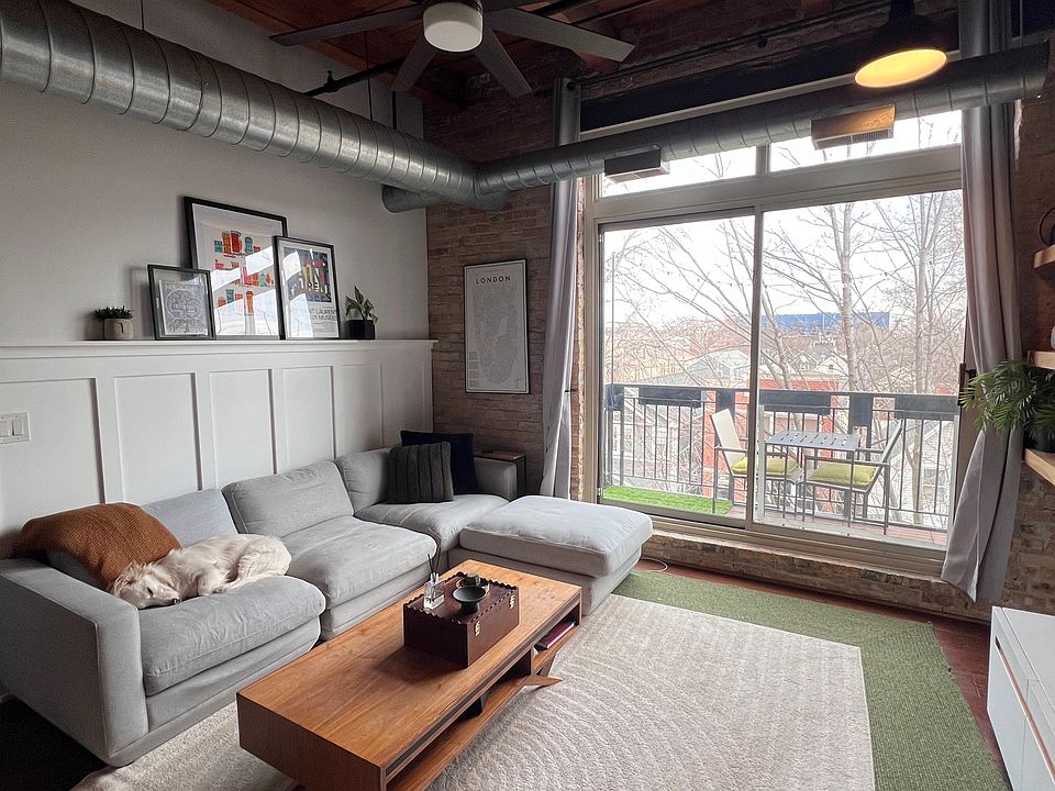 Open concept living room with a balcony