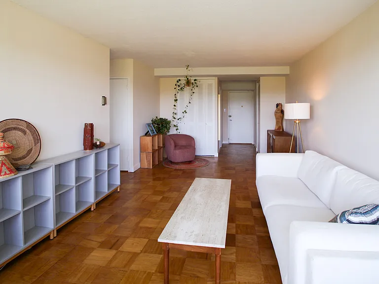 Living room view looking towards apartment entrance