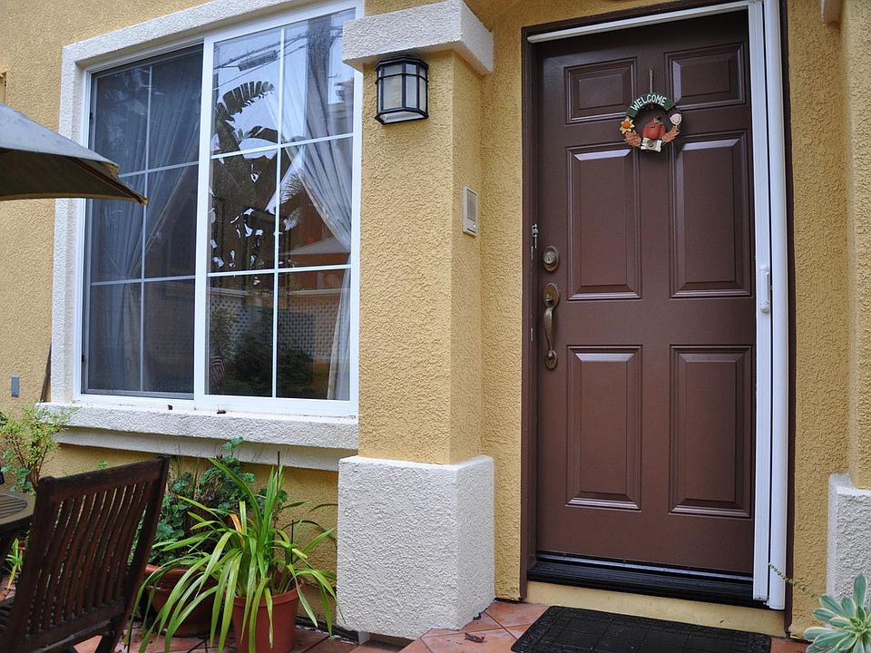 Front door with gated patio and bbq hookup