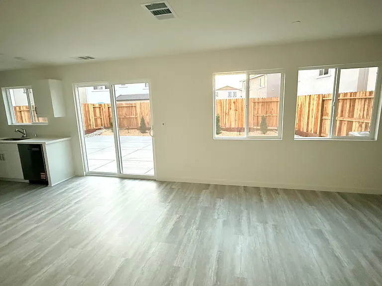 Flexible open space area that flows directly into a beautifully finished backyard