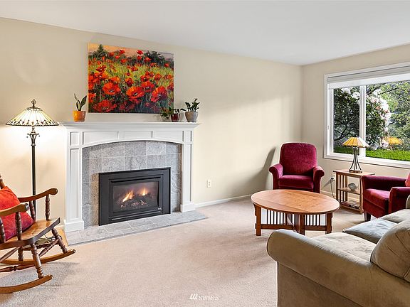 Formal living room offers a gas insert to keep you warm on the chilly PNW evenings