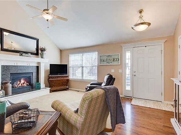 Great Room with Vaulted Ceilings & a Fireplace