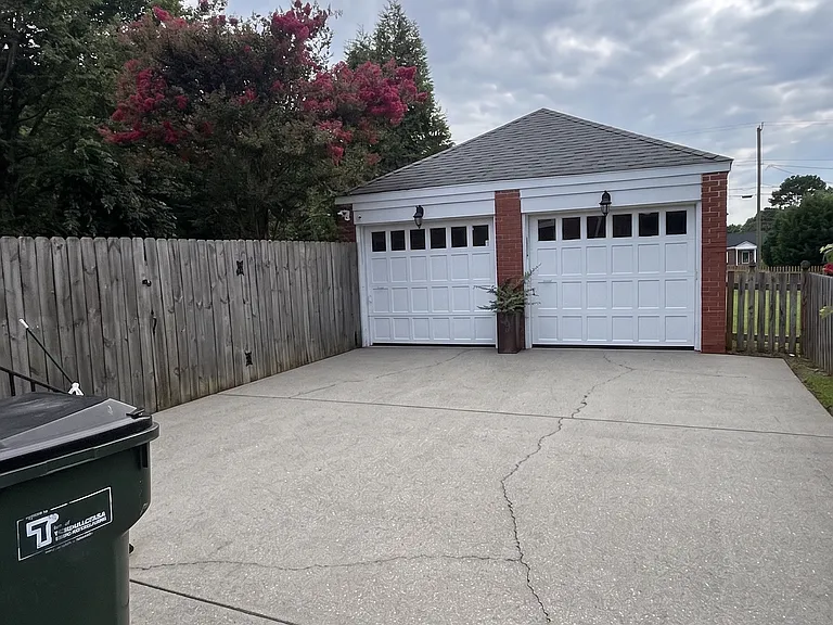 Two car garage with a work area in the rear.