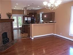 Dining area connects to kitchen through breakfast bar, also has FP