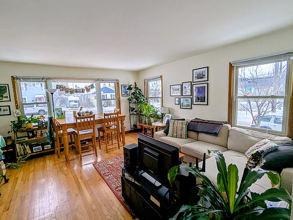 Wide-angle view of the living room from the hallway looking west