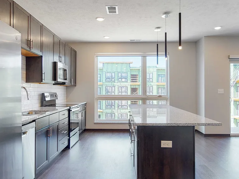 Floor-to-ceiling windows fill your home with natural light.