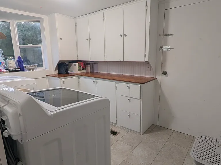 laundry room with back door