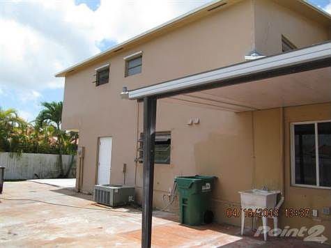 Illegal patio roof gone