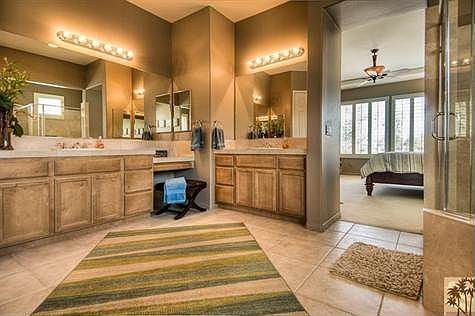 Master Bath features oval soaking tub, large shower with dual shower heads and spacious walk-in closet.