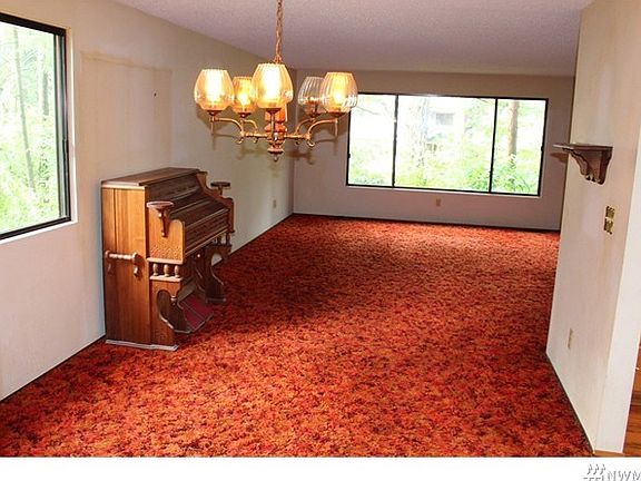 Formal dining area just off the living room with easy access to the covered deck and kitchen areas.