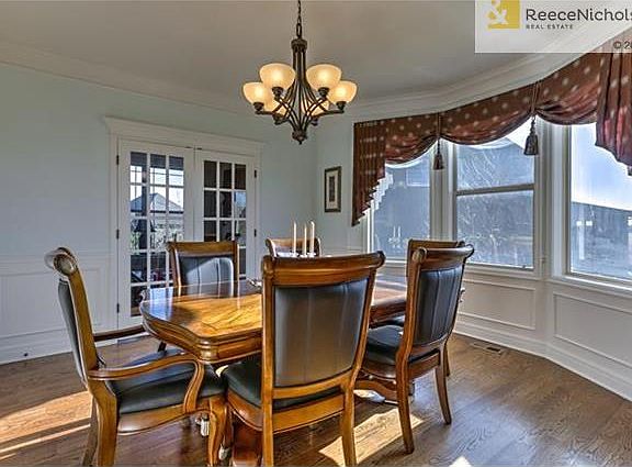 Beautiful Dining Room built specifically here because of its Prairie View of the Area! Dine in luxury with crown molding, wainscot trim, french doors off Living Room and open door direct to Kitchen.